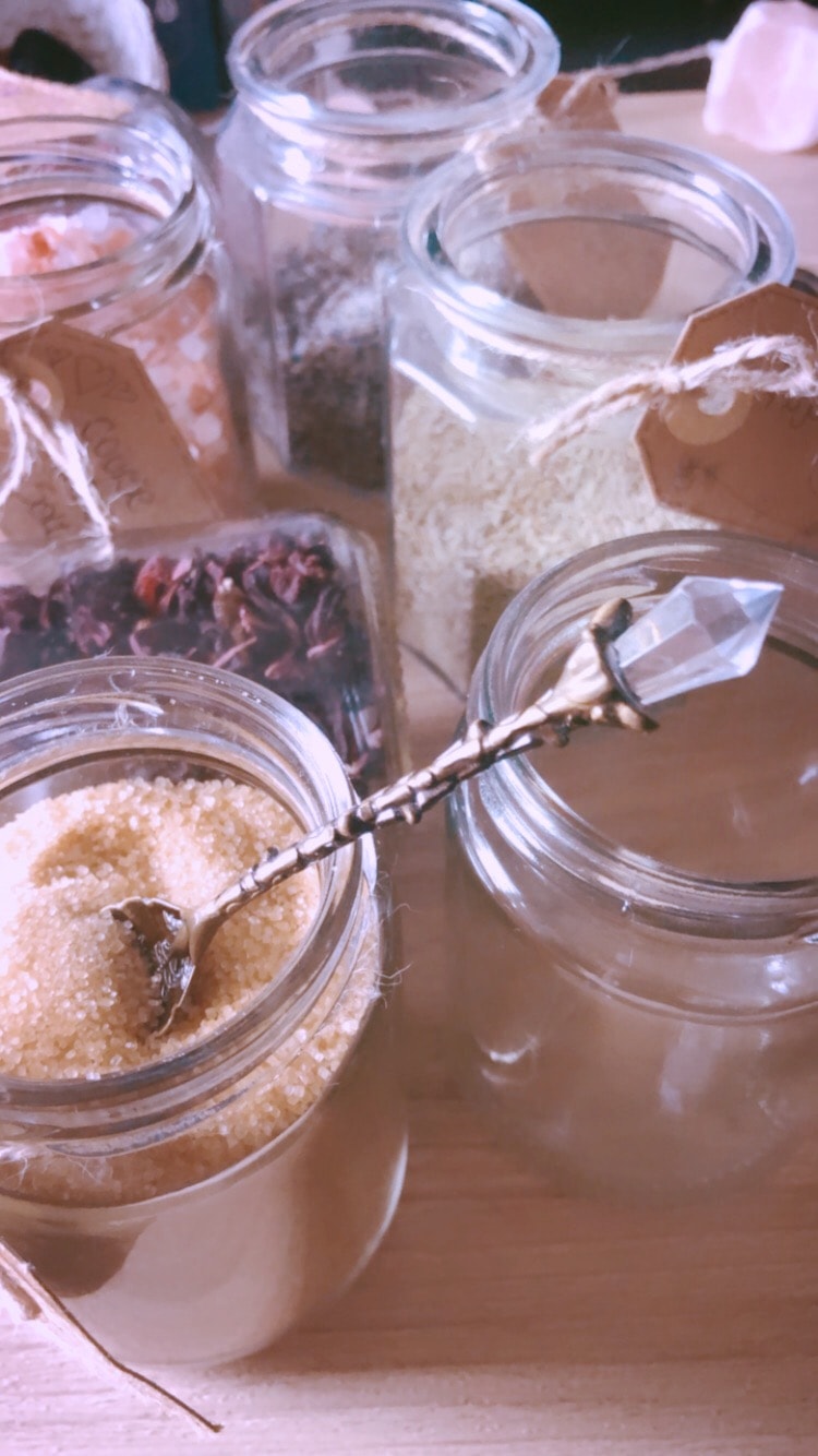 Selection of dried herbs and botanicals laid out for guests to choose from