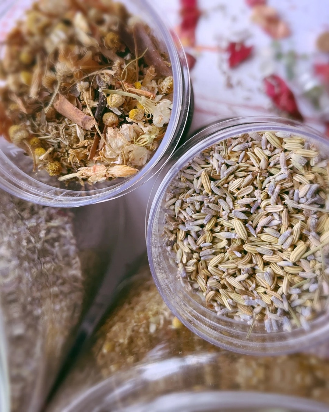 Dried botanical herbs including lavender, rosemary and chamomile